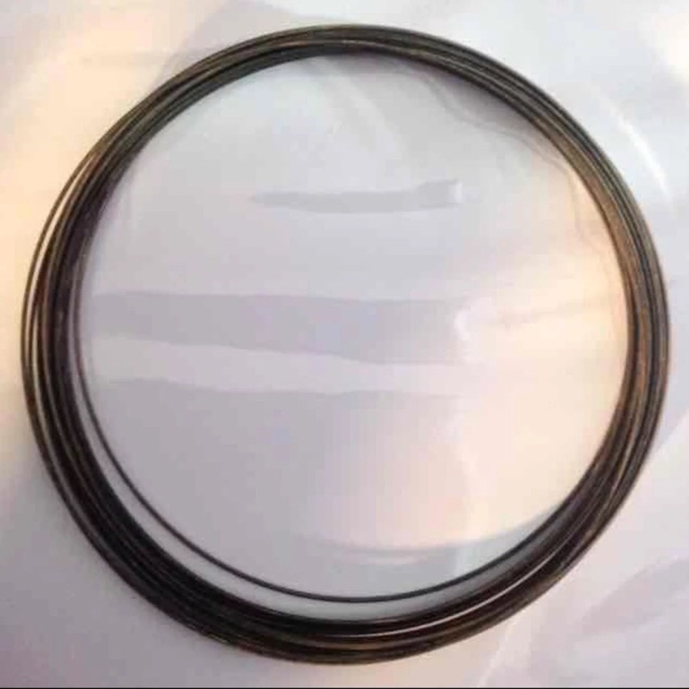 20-loop coil of bronze memory wire: 4.5” × 1 mm